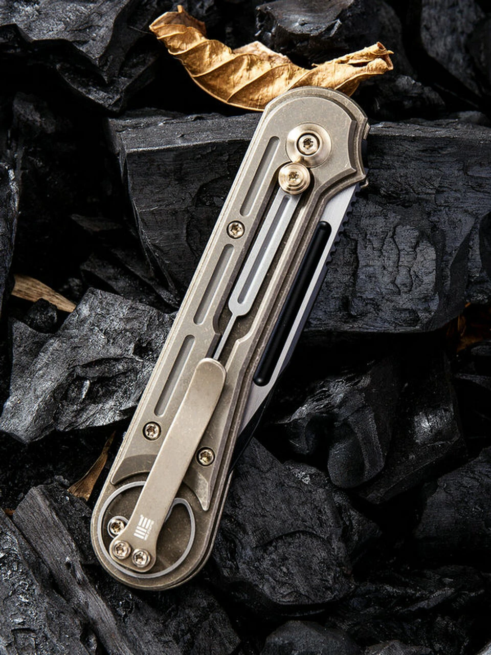 We Knife Co. We Knife Double Helix Folder 815A, 3.3" CPM S35VN Black Two-Tone Drop Point Plain Blade, Bronze Titanium Handle 4 We Knife Co. We Knife Double Helix Folder 815A, 3.3" CPM S35VN Black Two-Tone Drop Point Plain Blade, Bronze Titanium Handle - Image 4