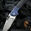 We Knife Co. We Knife Stixx Framelock Folder 817A, 3.45” Bohler-M390 Satin Drop Point Plain Blade, Carbon Fiber and Blue Titanium Handle