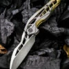 We Knife Co. We Knife Arrakis Framelock Folder 906C, 3.45” Bohler M390 Satin Wharncliffe Plain Blade, Gold and Gray Titanium Handle