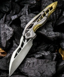 We Knife Co. We Knife Arrakis Framelock Folder 906C, 3.45” Bohler M390 Satin Wharncliffe Plain Blade, Gold and Gray Titanium Handle