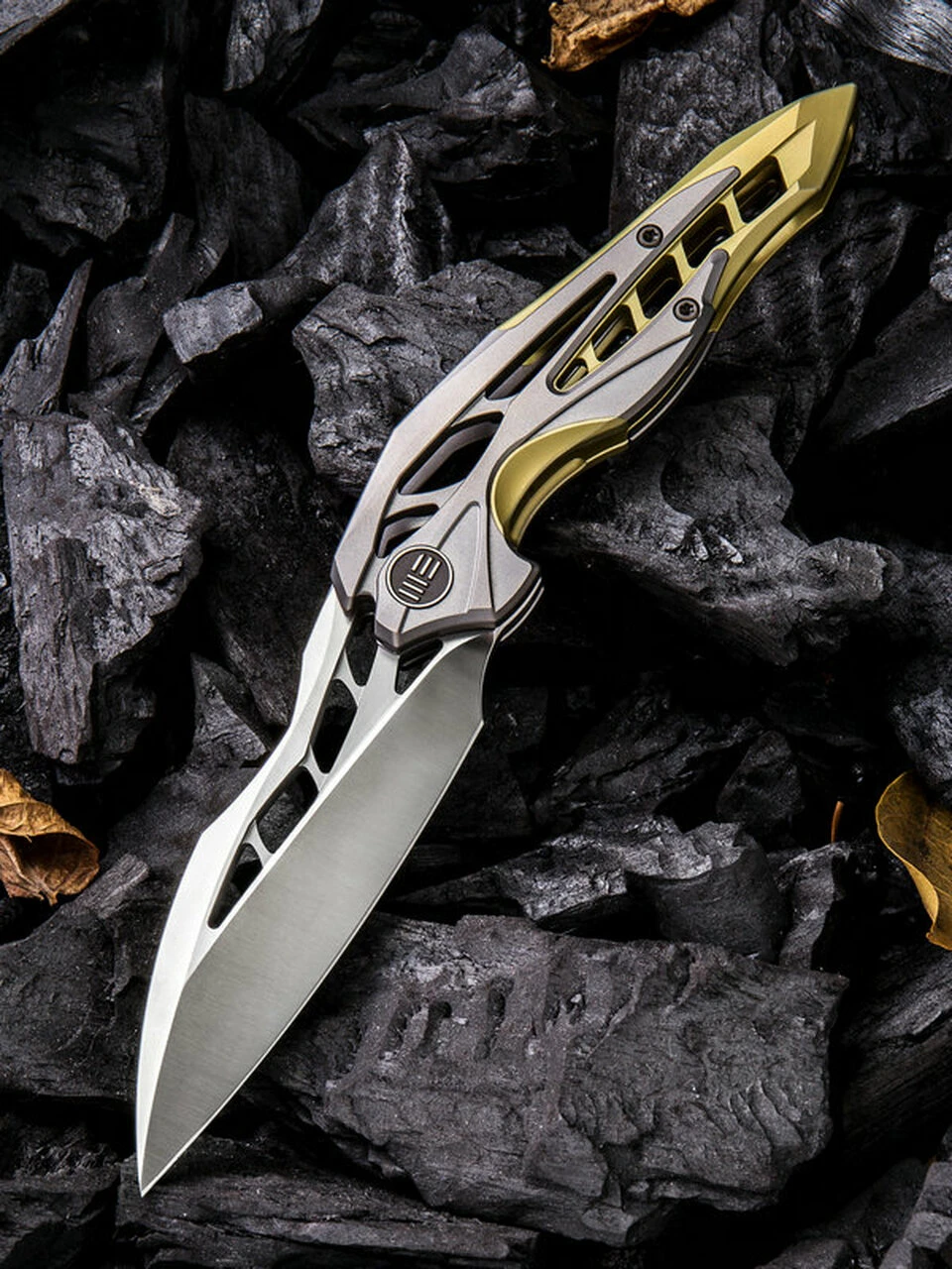 We Knife Co. We Knife Arrakis Framelock Folder 906C, 3.45” Bohler M390 Satin Wharncliffe Plain Blade, Gold and Gray Titanium Handle 1 We Knife Co. We Knife Arrakis Framelock Folder 906C, 3.45” Bohler M390 Satin Wharncliffe Plain Blade, Gold and Gray Titanium Handle