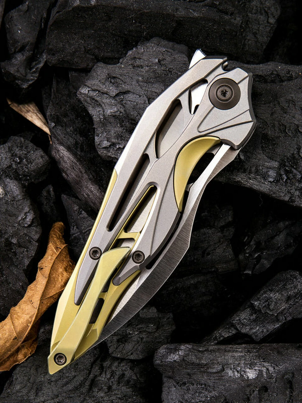 We Knife Co. We Knife Arrakis Framelock Folder 906C, 3.45” Bohler M390 Satin Wharncliffe Plain Blade, Gold and Gray Titanium Handle 4 We Knife Co. We Knife Arrakis Framelock Folder 906C, 3.45” Bohler M390 Satin Wharncliffe Plain Blade, Gold and Gray Titanium Handle - Image 4