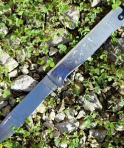 Douk-Douk Folder - Squirrel. 3 5/16" carbon steel blade. Silver finish folded steel handles with bail.